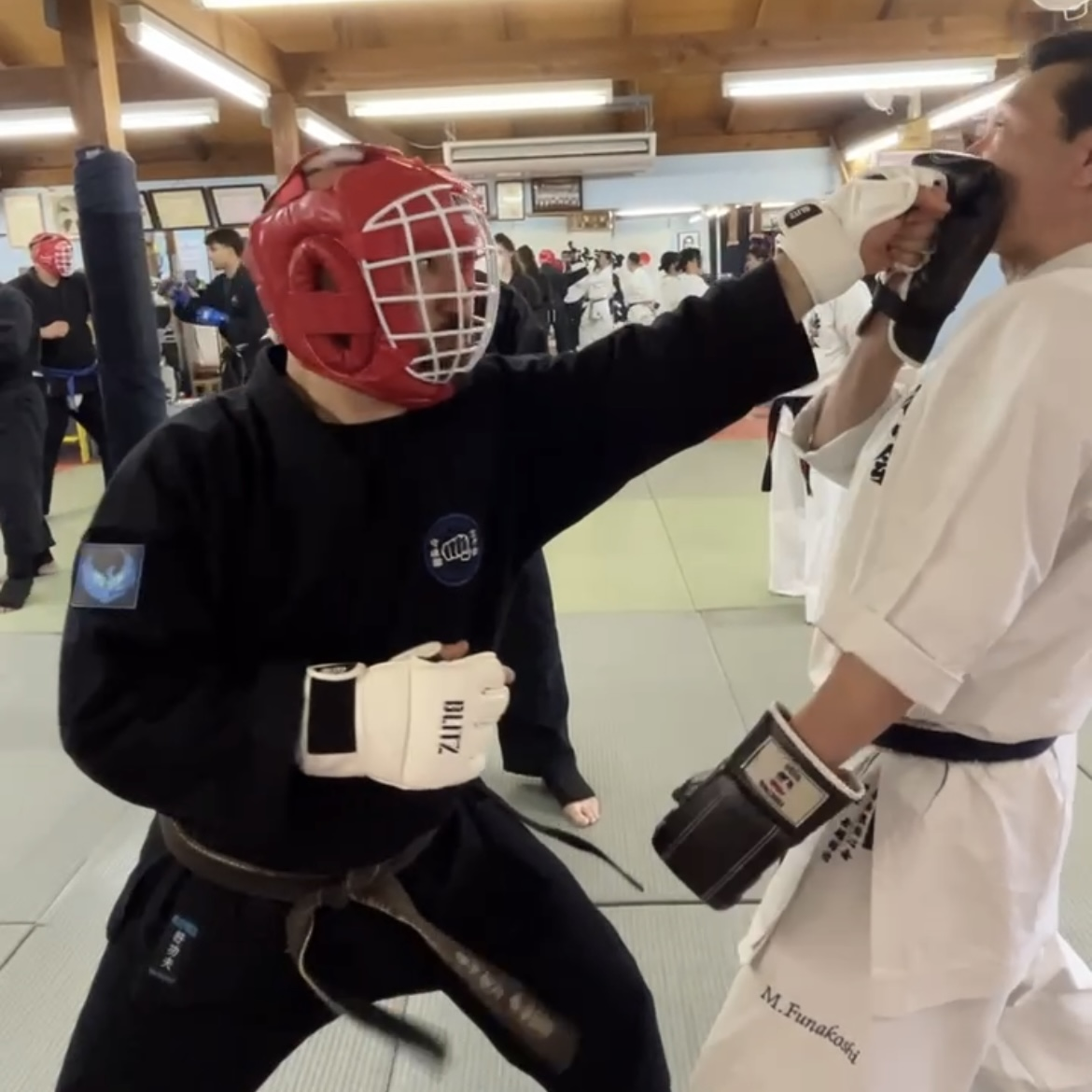 Olgun Tiltay in Ichinomiya Japan practicing with Funakoshi Masaharu Sensei [8th Dan Karate of Nahate Origin]